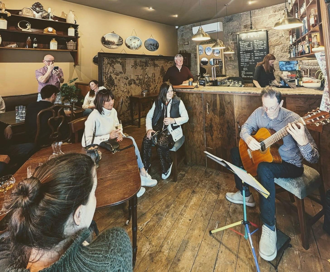 Classical guitar, wine and sharing platters on a Sunday afternoon