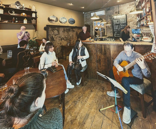 Classical guitar, wine and sharing platters on a Sunday afternoon